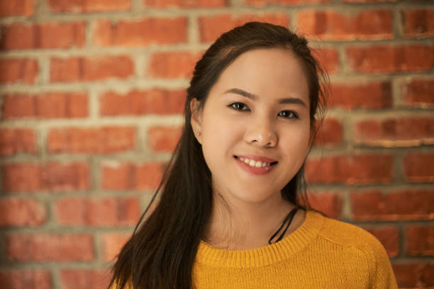 istock Asian woman feeling happy smiling and looking to camera 1289757385