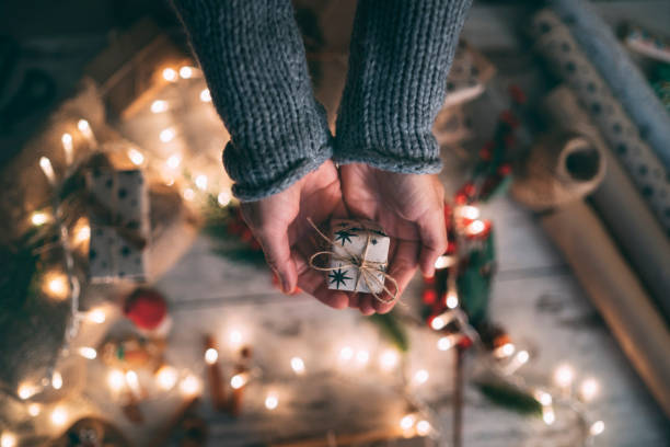 istock Woman palms holding present for Christmas 1289757807