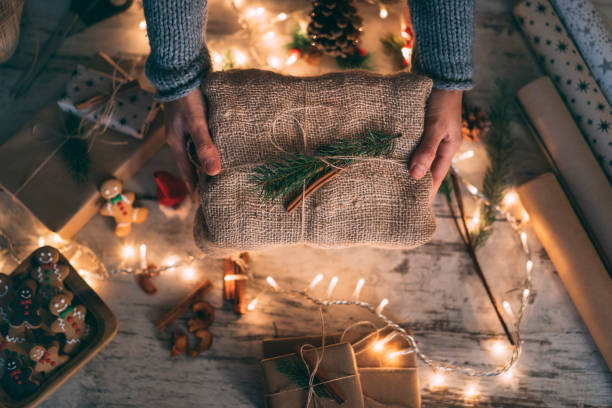 istock Woman holding Christmas present 1289757810