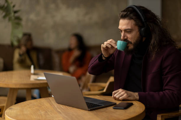 istock Young Caucasian male freelancer working on his laptop 1289759032