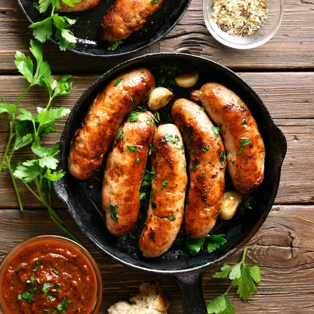 istock Roasted sausages in frying pan 1289759693