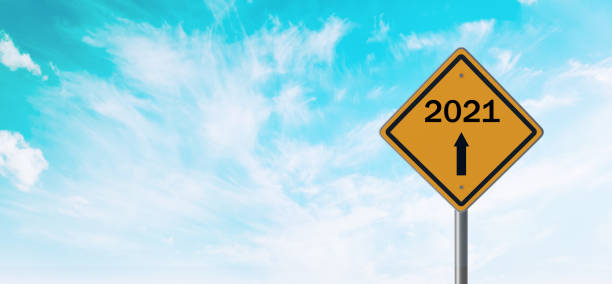istock 2021 concept, highway sign in road ahead 2021 way 1289762395