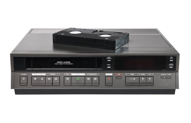 Old videocassette recorder 1980s-1990s with videotape isolated on white background. foreground Old videocassette recorder 1980s-1990s with videotape isolated on white background. foreground vcr photos stock pictures, royalty-free photos & images