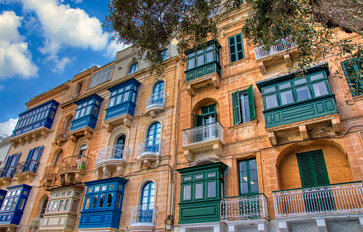 Famous colorful wooden balconies in narrow streets of Malta, Valletta. Architectural Maltese feature of of the island