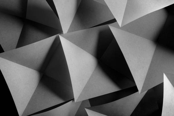 istock Abstract background, paper folded in geometric shapes 1289765624