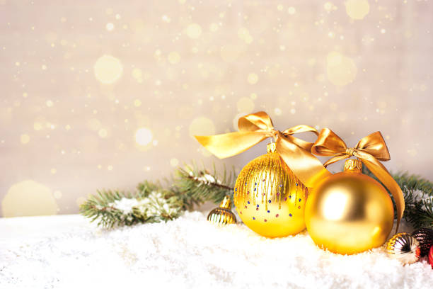 istock Christmas holidays composition on light background with copy space for text. Two beautiful golden Christmas balls close up, selective focus, bokeh. New year card 1289767928