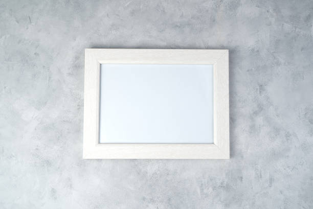 istock Minimalistic white frame with space for copying, on a concrete background. 1289769361