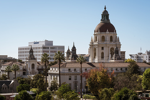 Pasadena, California, USA: image showing the Pasadena City Hall in the foreground. Pasadena is located in Los Angeles County, California.