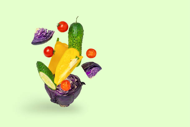 istock Fresh vegetables, salad ingredients, on a green background 1289770528