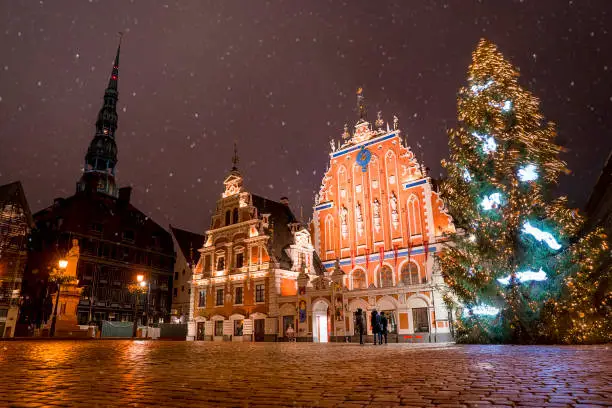 Photo of Panorama Of Town Hall Square, Popular Place With Famous Landmarks On It In Bright Evening Illumination In Winter Twilight. Winter New Year Christmas Holiday Season.
