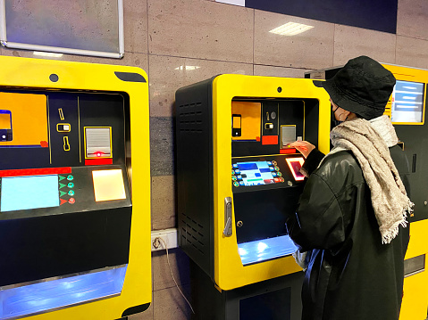 atm, ticket, subway station, station, one person, currency