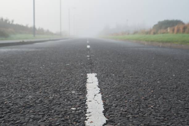 istock Road and its markings stretching into the distance 1289776677