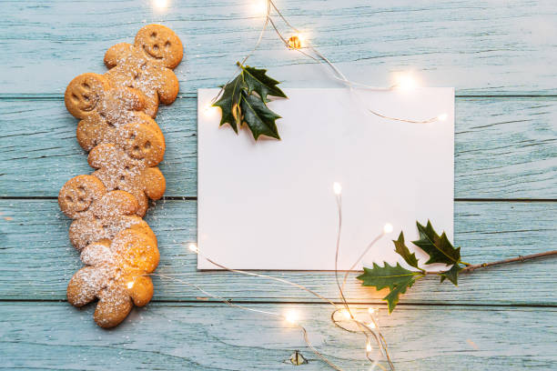 istock a stack of gingerman cookies on the table with white blank card 1289777417