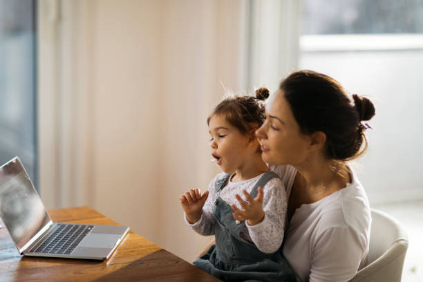 istock Happy Caucasian mother working from home 1289777738