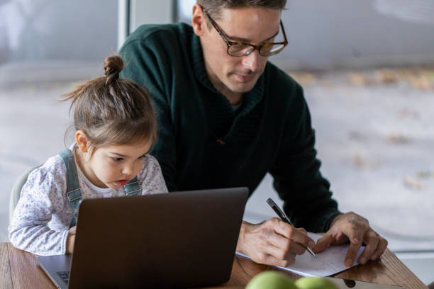 istock Young Caucasian father working from home 1289777928