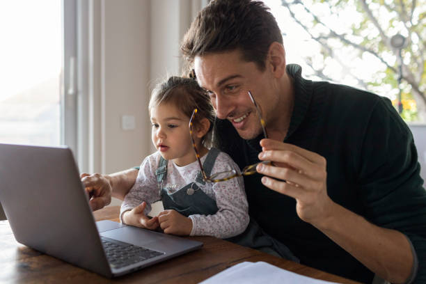 istock Young Caucasian father working from home 1289778214