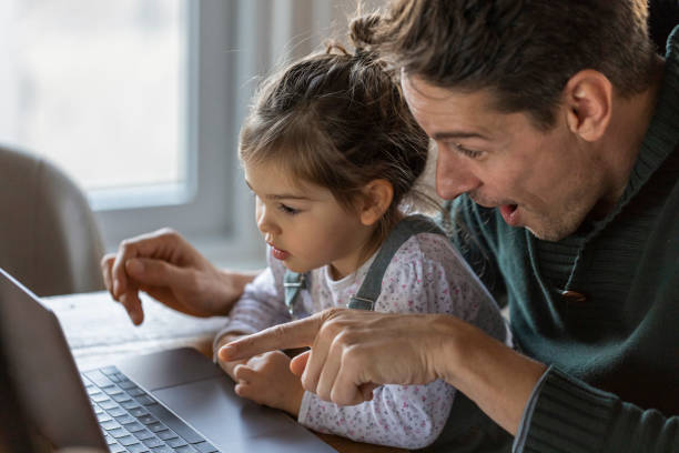istock Young Caucasian father working from home 1289778763