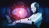 roboter-humanoid-verwenden-laptop-und-sitzen-am-tisch-in-konzept-der-ki-denken-gehirn.jpg?b=1&s=170x170&k=20&c=oPXpBfXz_BsBhV_TygCb4rE35aG8UC921wXQbPFR9aQ=