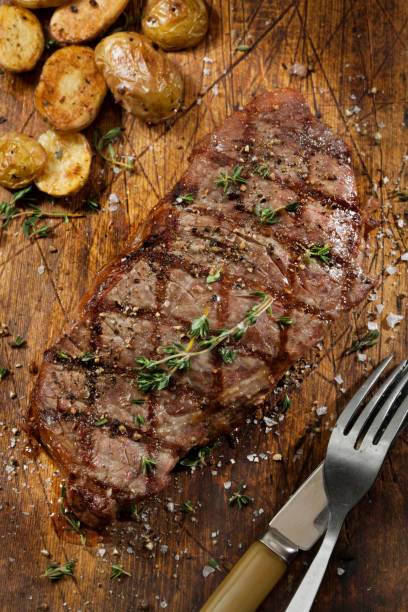 istock Medium Rare Sirloin Steak with Roasted Potatoes 1289779157