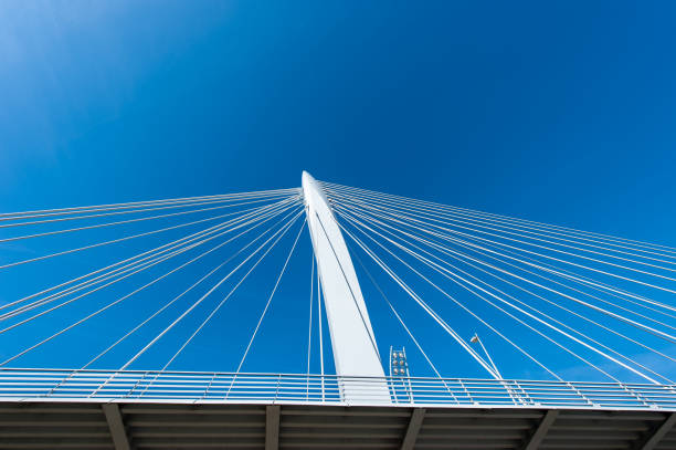 Footpath, pylon and steel wires of the Prins Clausbrug (Prince Clausbridge) in Utrecht. This is a cable-stayed bridge that spans the Amsterdam-Rhine canal and connects the quarters Kanaleneiland and Papendorp.
