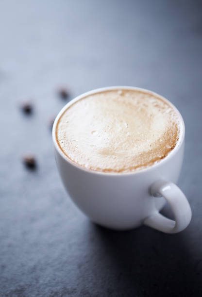 istock Cup of coffee on dark stone background. Close up. 1289782246