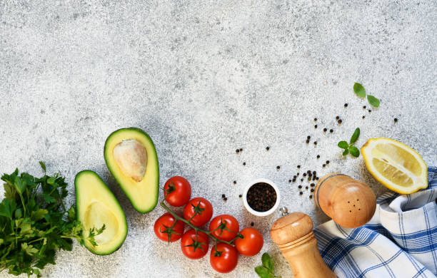 istock Ingredients for making guacamole sauce. Food on a concrete table with space for text. 1289785305