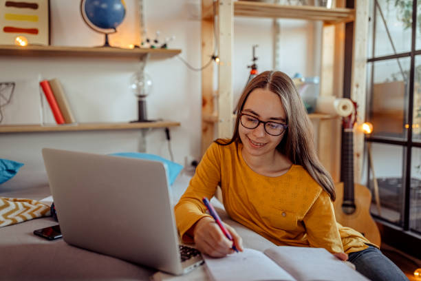 istock Distance learning from home on video conference call 1289788619