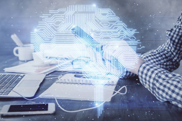 istock Double exposure of man's hand holding and using a digital device and brain hologram drawing. Data concept. 1289789396