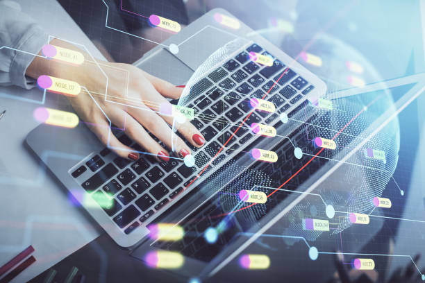 istock Double exposure of woman hands working on computer and world map hologram drawing. International technology business concept. 1289789420