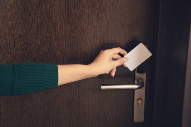 istock woman holding a key card 1289789597