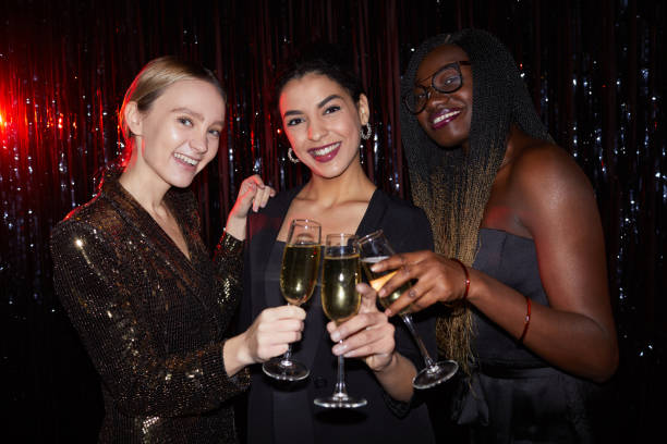 istock Elegant Young Women Drinking at Party 1289792777