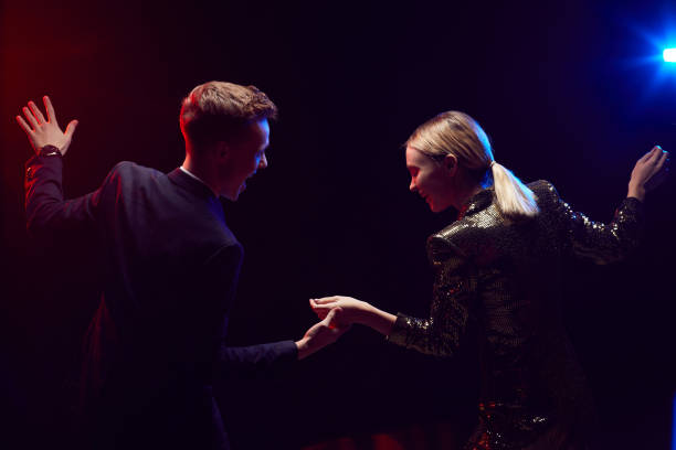 istock Young Couple Dancing at Party 1289792838
