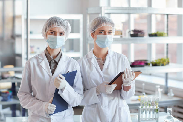 istock Portrait of Two Female Medics in Laboratory 1289792949