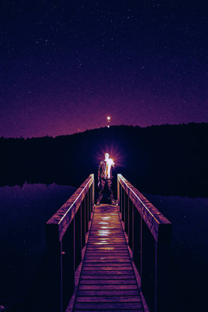 istock abstract art, photo at night, guy with light 1289794109