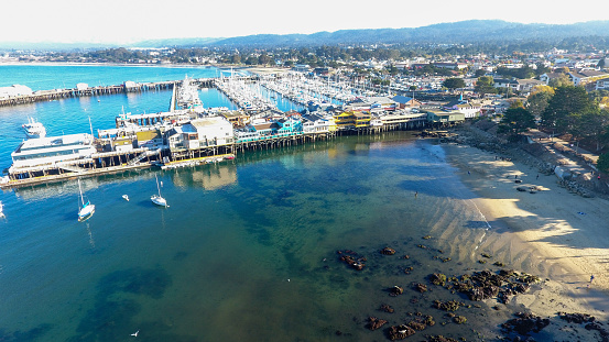 Aerial Drone view of Monterey Bay Wharf California with the ocean shot in 4k high resolution