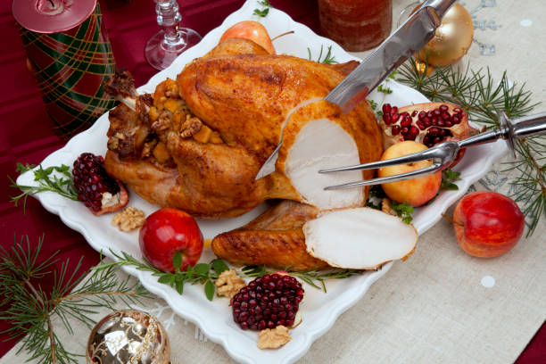istock Carving Christmas Pomegranate Glazed Roasted Turkey 1289799676