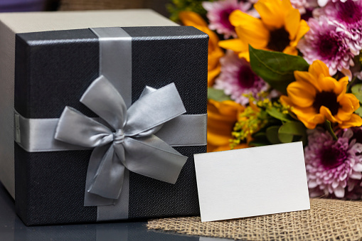 Gray Gift Box with flowers and white tag