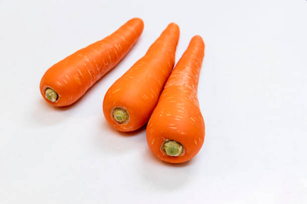 istock Fresh carrots with light orange color 1289806200