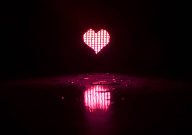 istock Valentine day background with neon red heart 1289807213