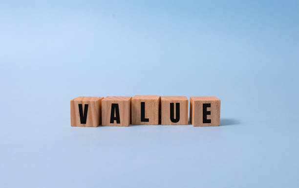 istock VALUE word written on wood block on blue background 1289808207