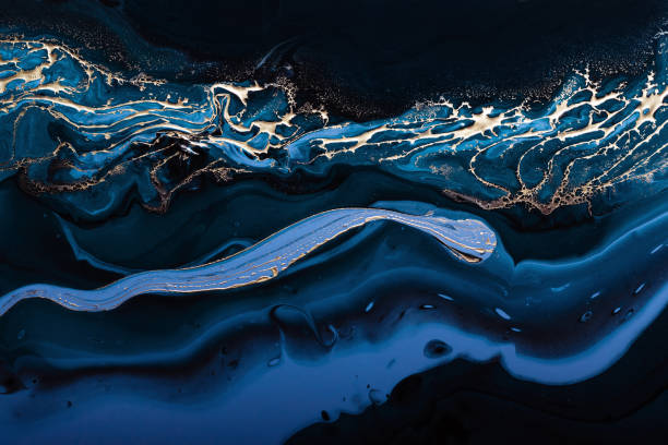 fluid ek. flüssiges metallic gold in abstrakten blauen welle. marmoreffekt hintergrund oder textur - textured effect contemporary painted image mottled stock-fotos und bilder