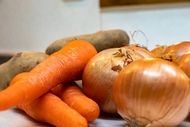 istock Lots of fresh vegetables on the kitchen counter 1289812351