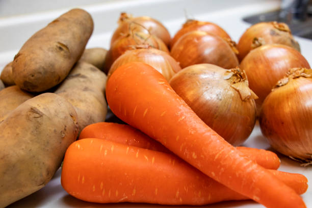 istock Lots of fresh vegetables on the kitchen counter 1289812399