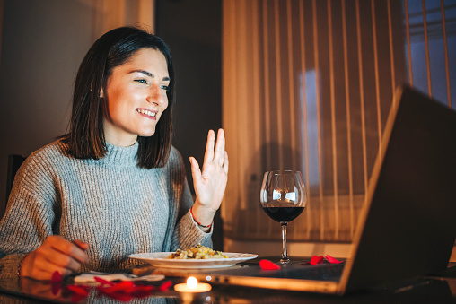 Woman in video call on Valentines day - Social relations at Covid-19 social distancing times