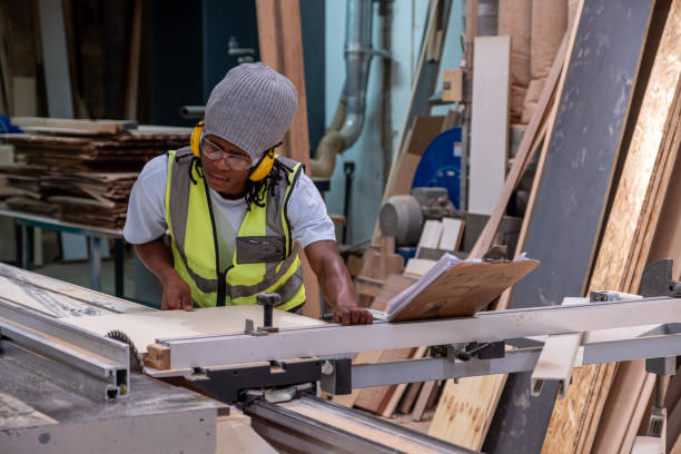 istock Young African man working in a timber factory 1289817997