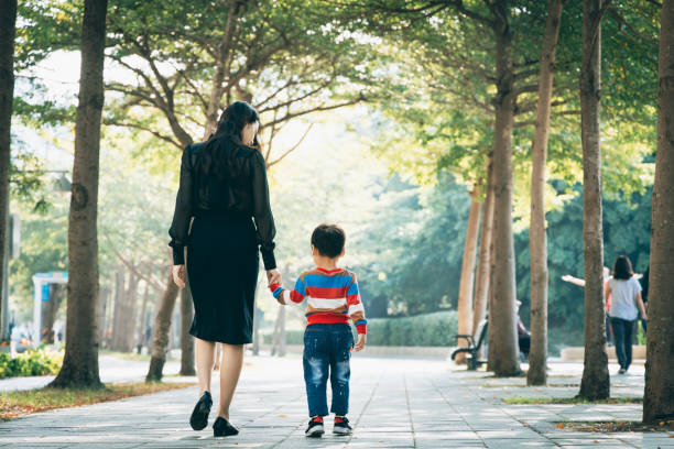 Parents play with kid outdoor
