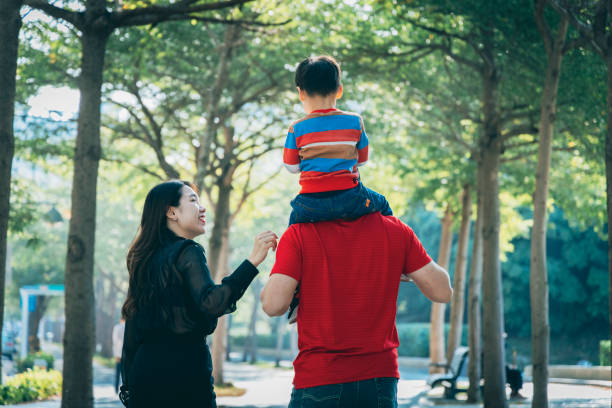 istock Parents play with kid outdoor 1289818897