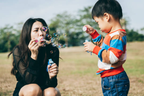 istock Parents play with kid outdoor 1289818953