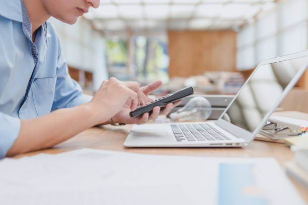 istock businessman using calculator for calculate budget accountancy, business data. finance and accounting concept 1289820594