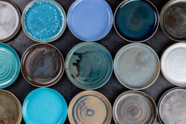 istock abstract background made of decorative empty round ceramic dishes different colors, plates in the pottery workshop, handwork, top view 1289821480